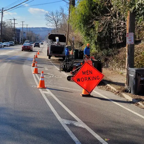 Men Working Sign
